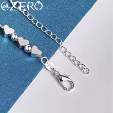Pulsera oro y plata de corazones
